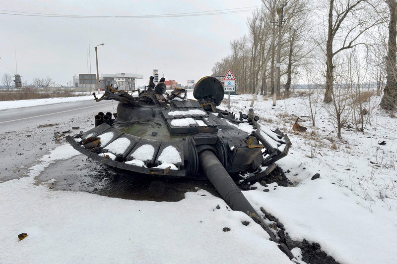 TOPSHOT - A fragment of a destroyed Russian tank is seen on the roadside on the outskirts of Kharkiv on February 26, 2022, following the Russian invasion of Ukraine. - Ukrainian forces repulsed a Russian attack on Kyiv but 